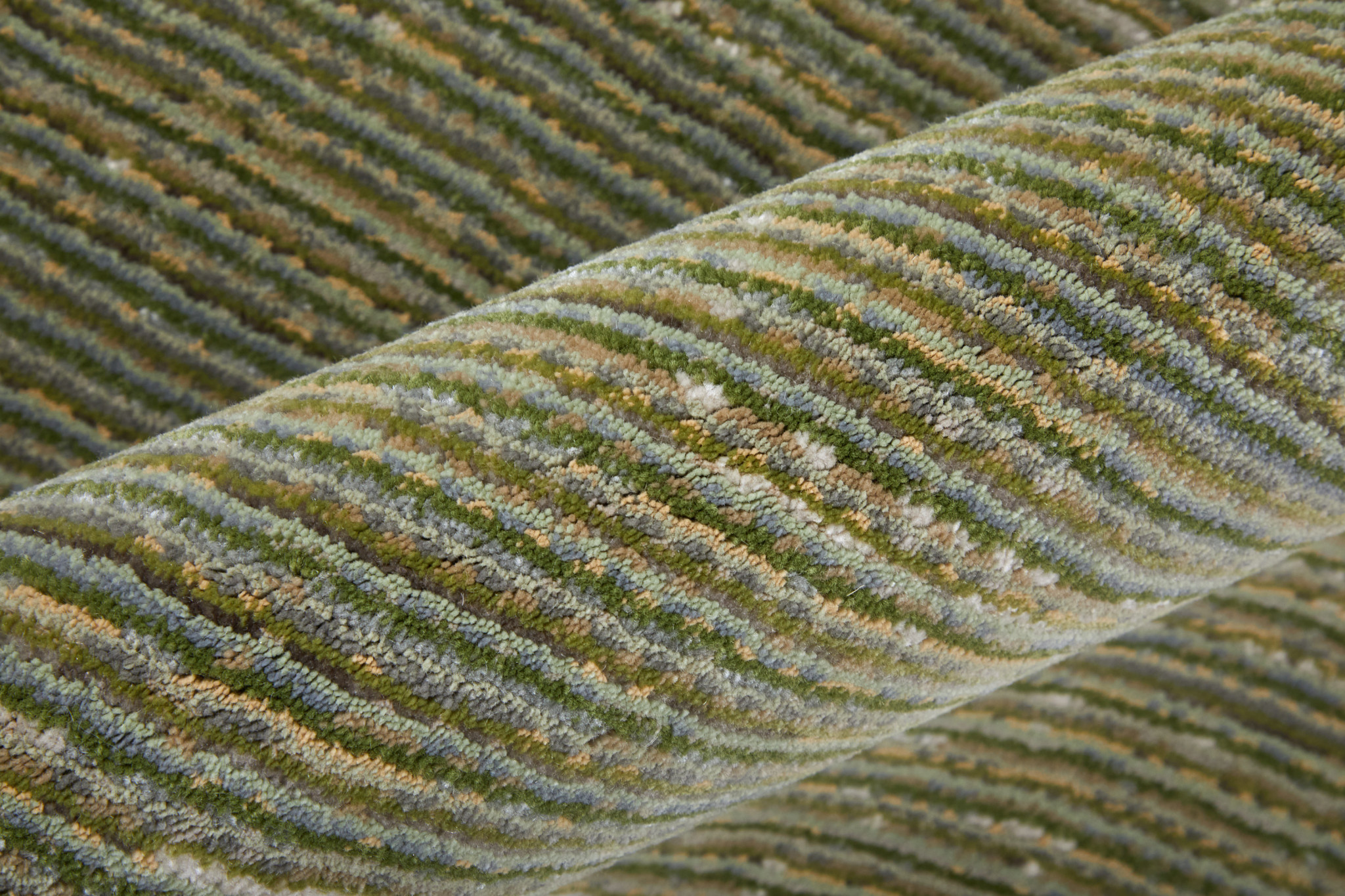 2" X 3" Tan and Green Power Loom Area Rug