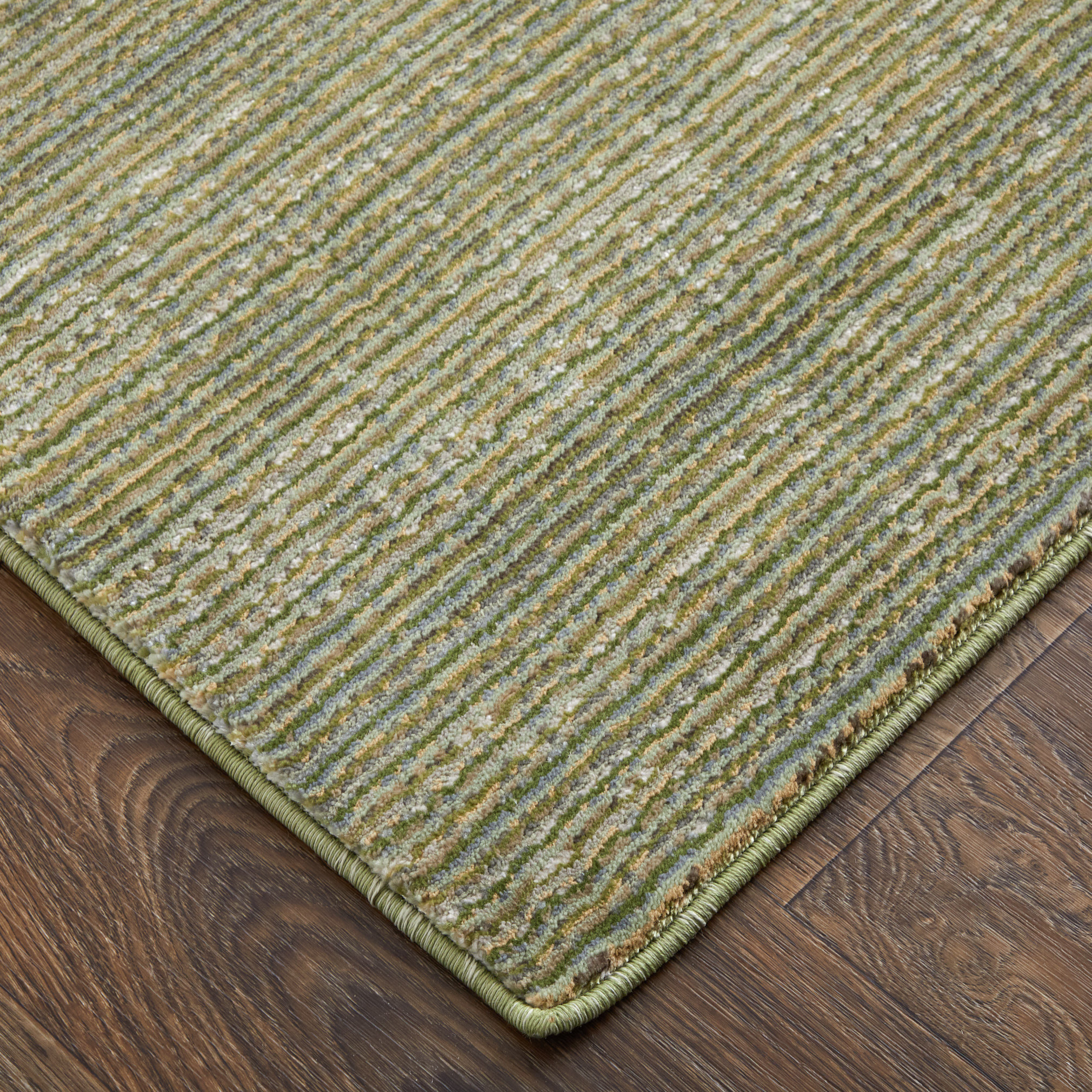2" X 3" Tan and Green Power Loom Area Rug