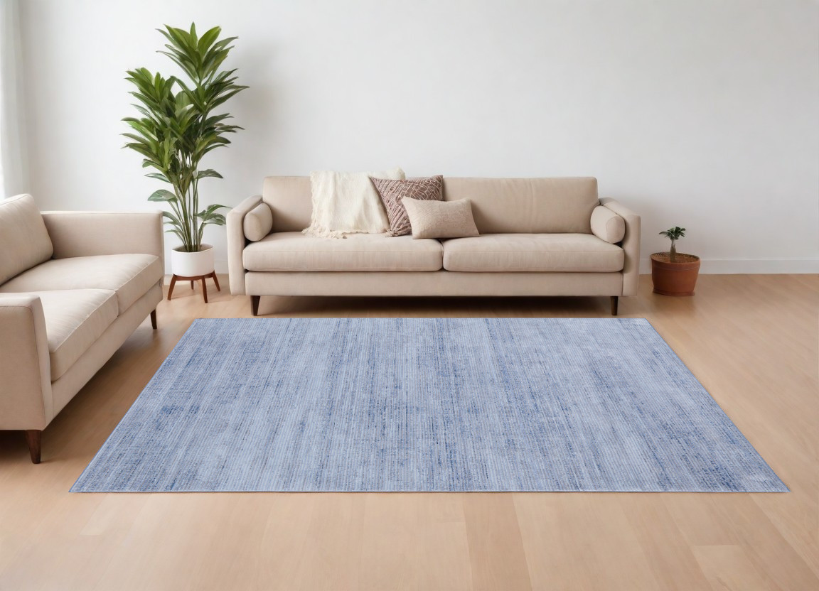 7" X 10" Blue and Ivory Power Loom Area Rug