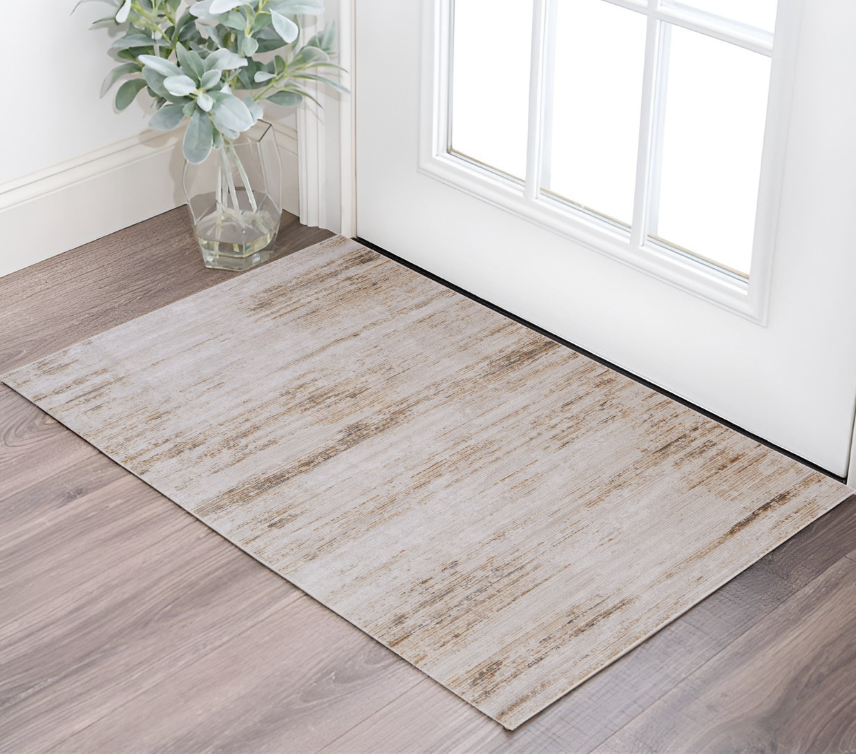 2" X 3" Ivory and Tan Abstract Power Loom Worn Faded Area Rug