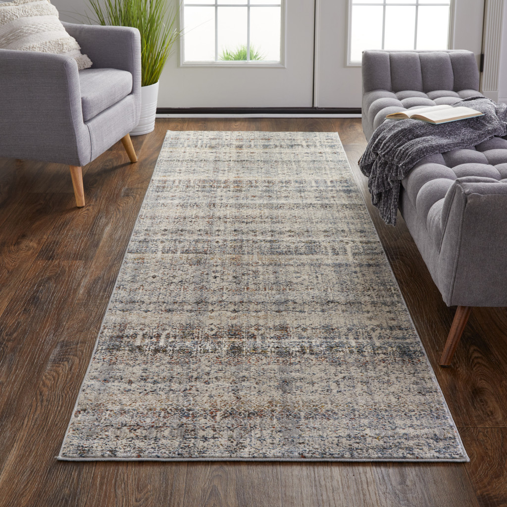 10" Gray Ivory and Blue Abstract Power Loom Worn Faded Runner Rug With Fringe