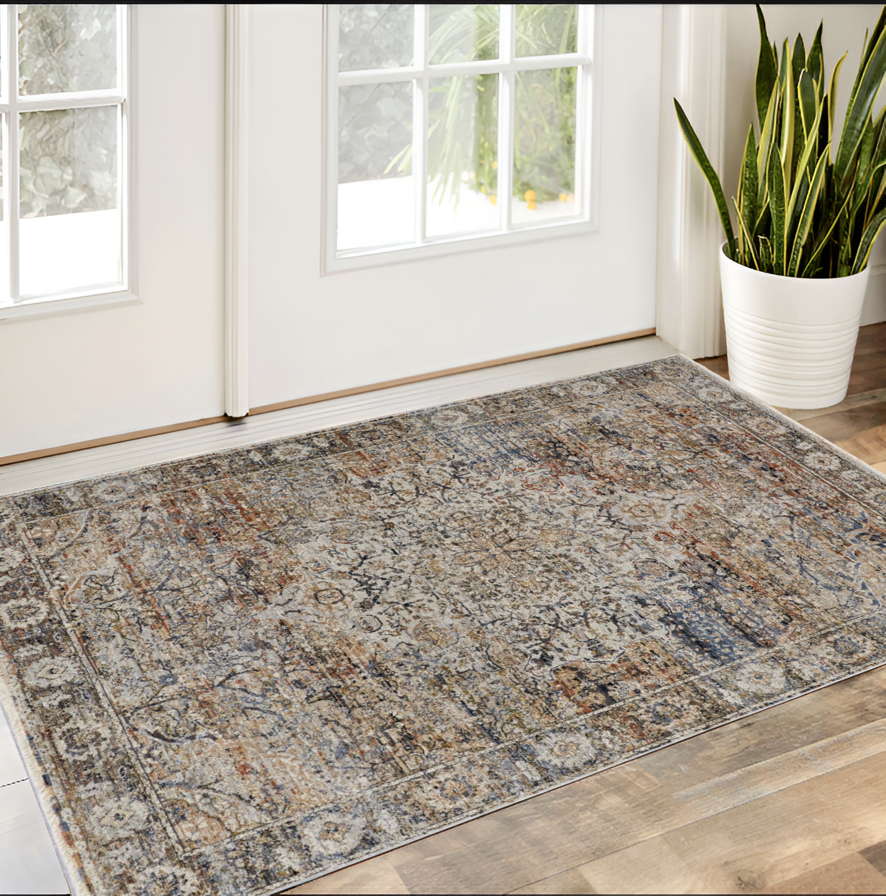 3" X 5" Tan Blue and Brown Oriental Power Loom Area Rug With Fringe