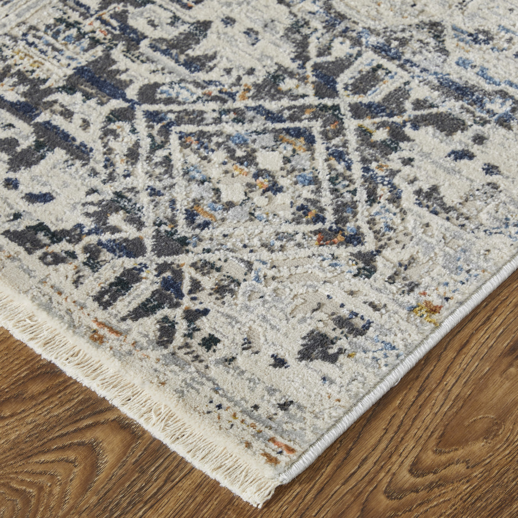 3" X 5" Ivory and Gray Abstract Power Loom Worn Faded Area Rug With Fringe
