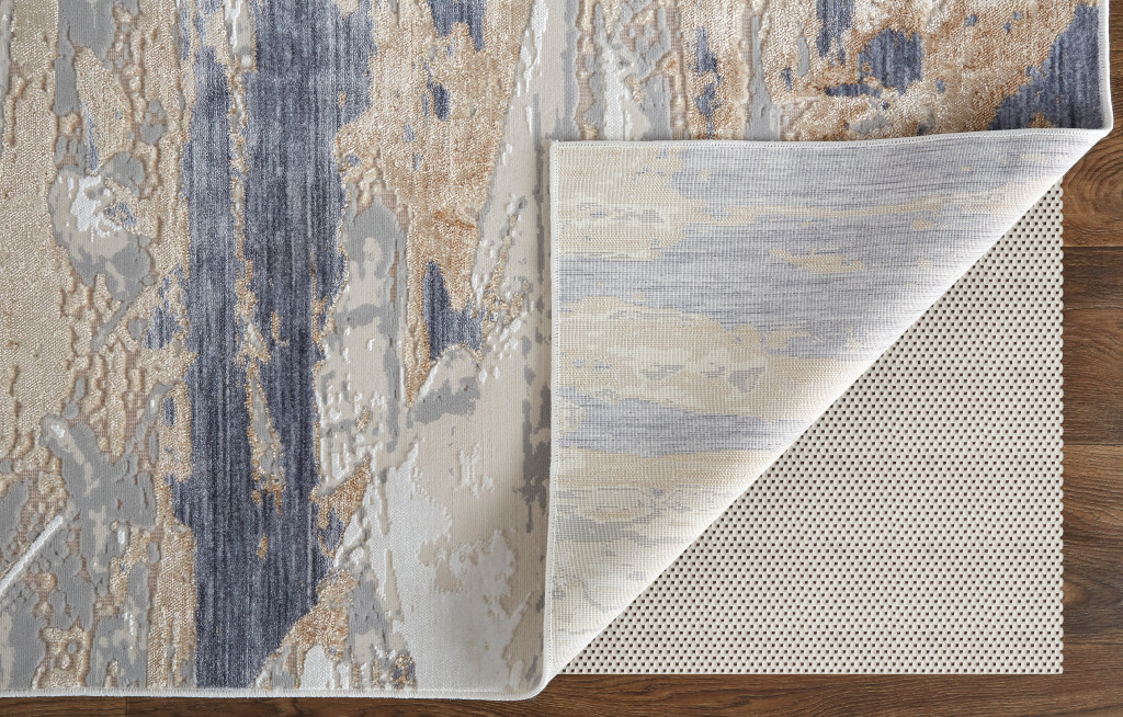 3" X 5" Tan Ivory and Blue Abstract Power Loom Worn Faded Area Rug