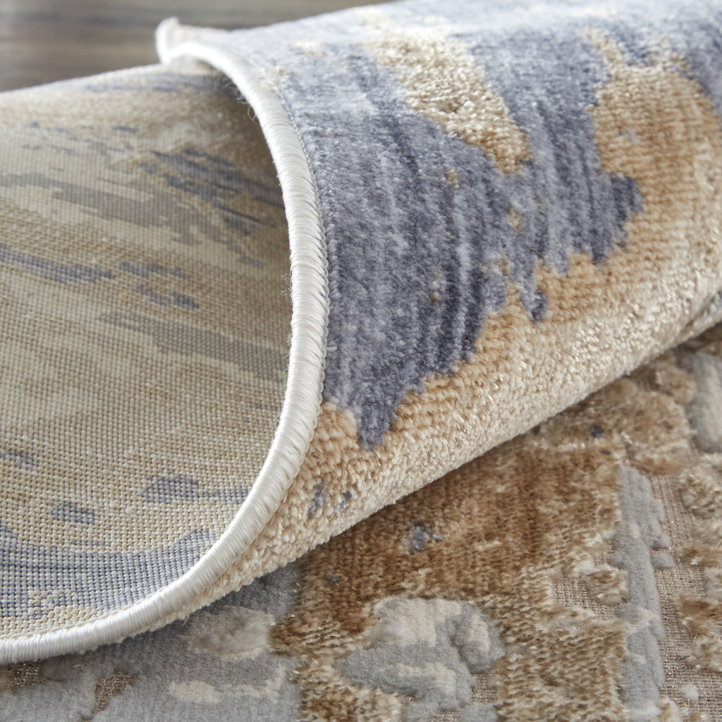 3" X 5" Tan Ivory and Blue Abstract Power Loom Worn Faded Area Rug