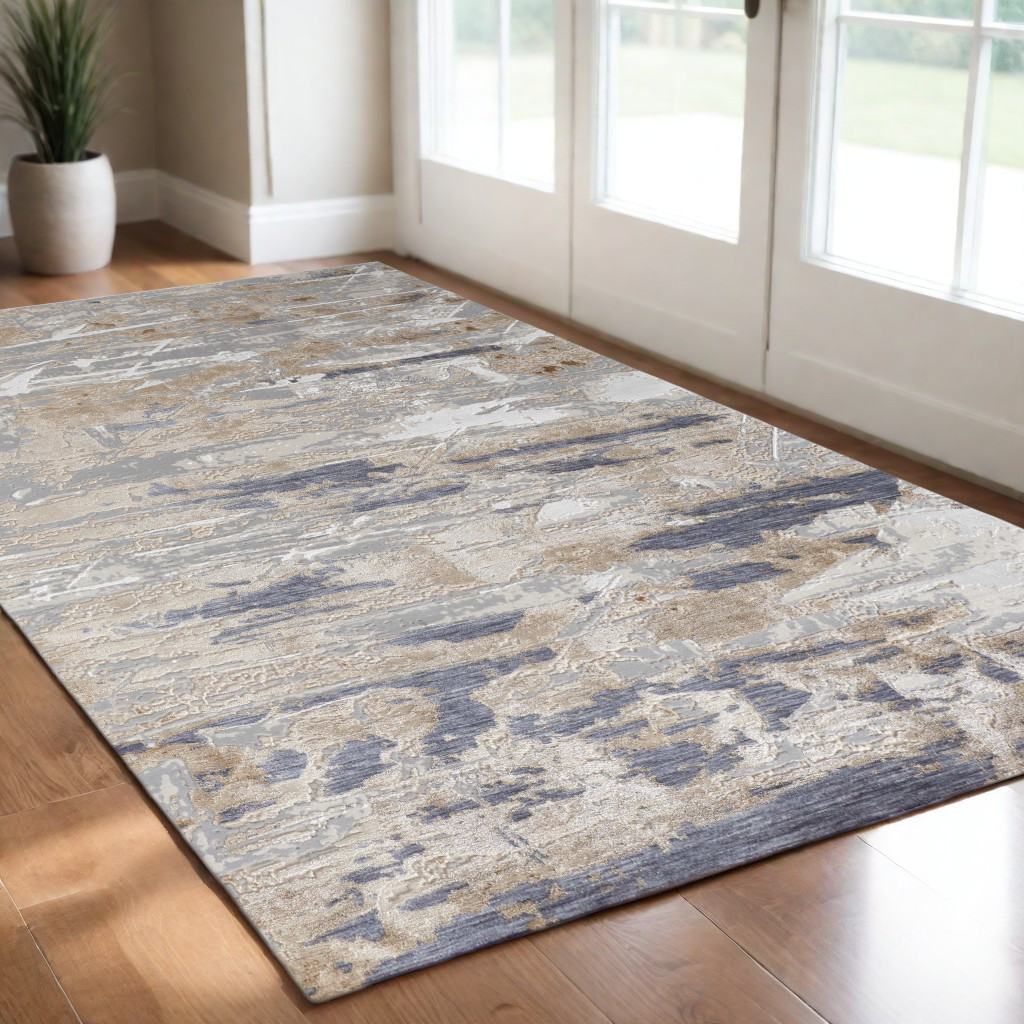 3" X 5" Tan Ivory and Blue Abstract Power Loom Worn Faded Area Rug