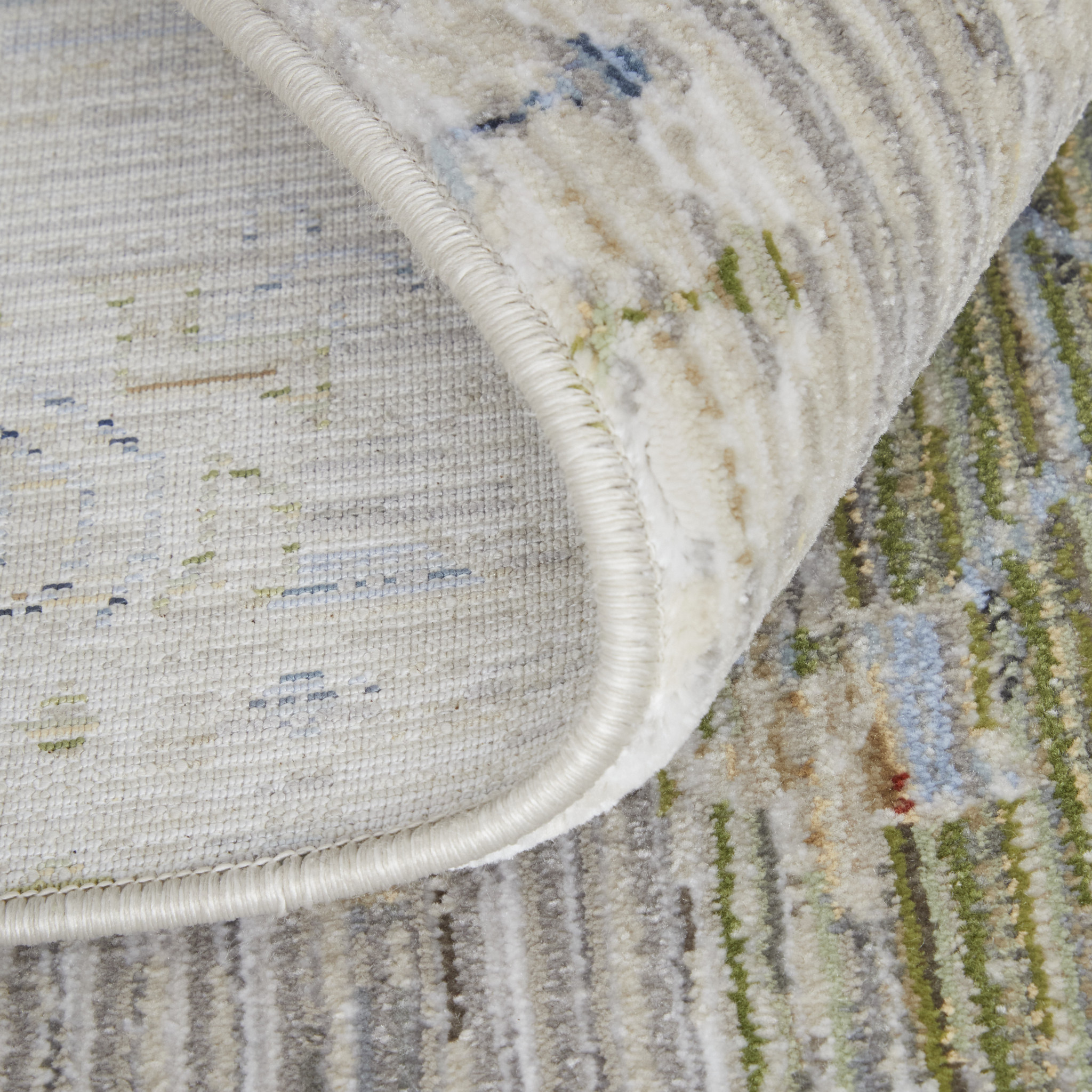 9" X 13" Ivory Green and Blue Abstract Power Loom Worn Faded Area Rug