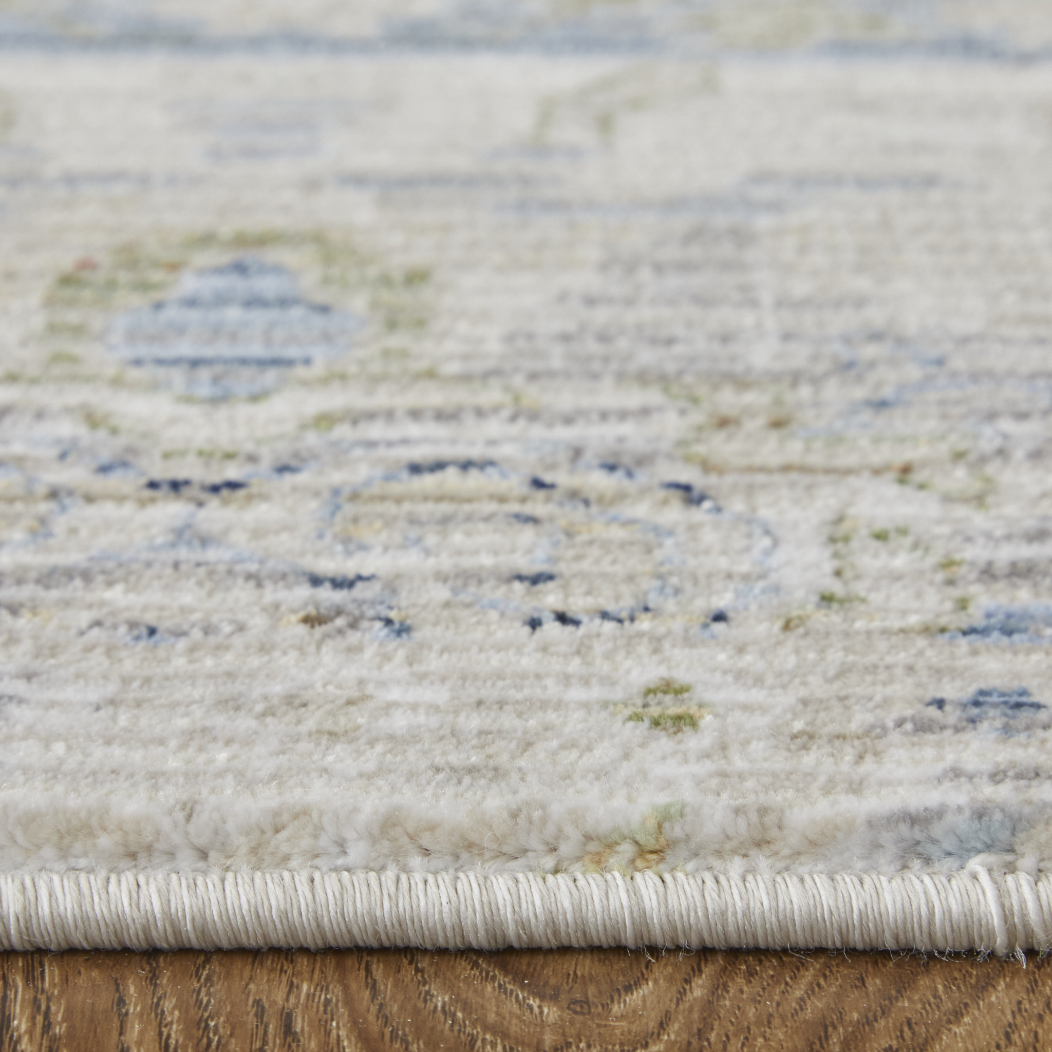 9" X 13" Ivory Green and Blue Abstract Power Loom Worn Faded Area Rug