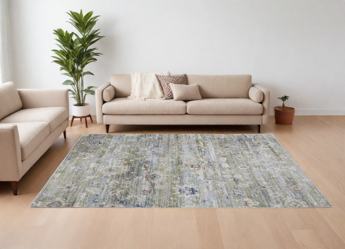 9" X 13" Ivory Green and Blue Floral Power Loom Worn Faded Area Rug