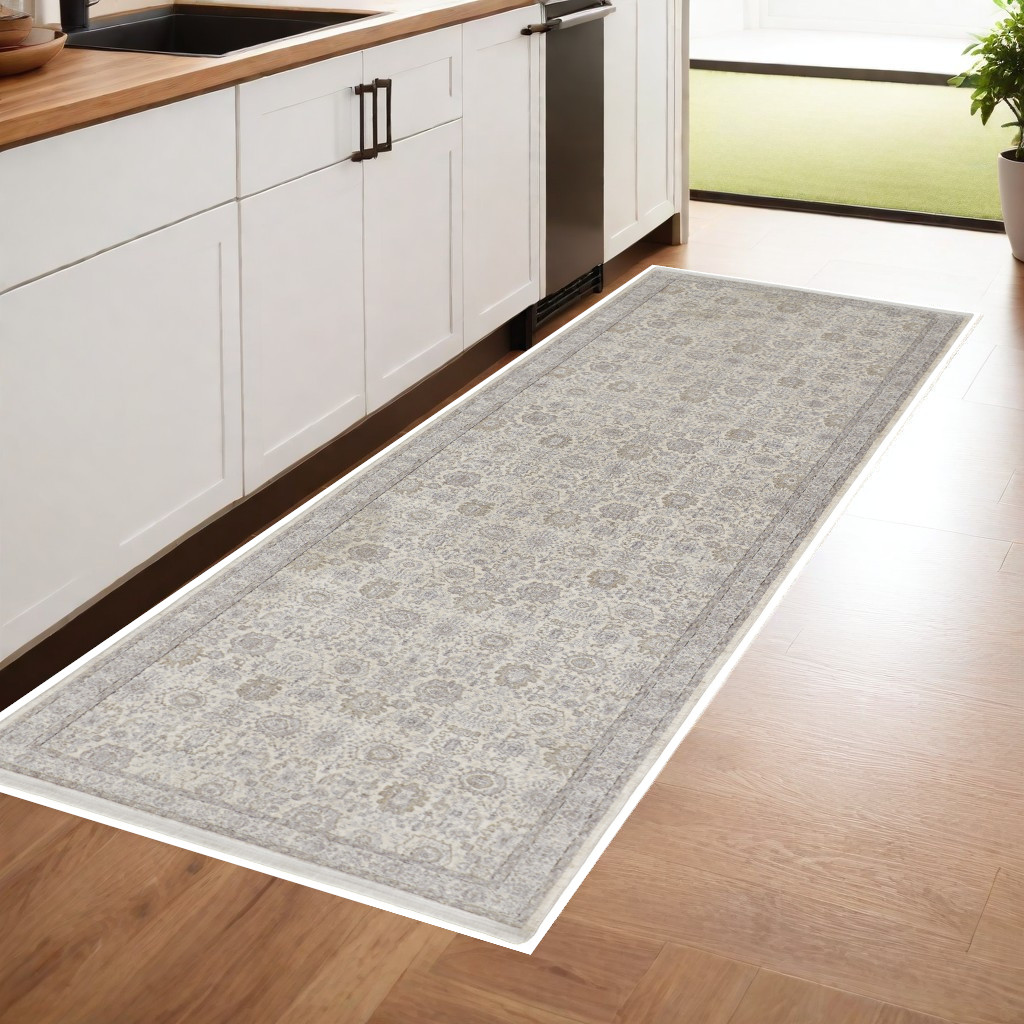 8" Gray and Ivory Oriental Power Loom Worn Faded Runner Rug With Fringe