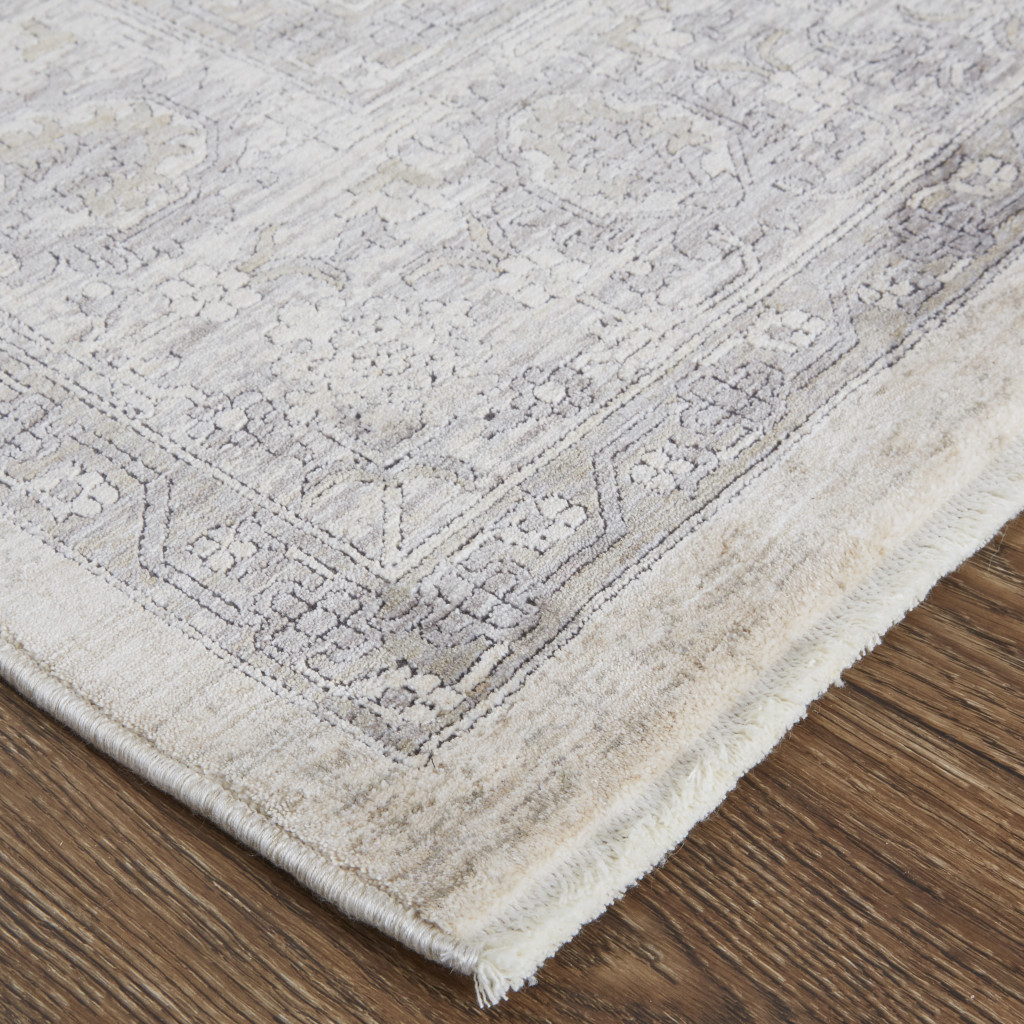 2" X 3" Gray and Ivory Oriental Power Loom Worn Faded Area Rug With Fringe