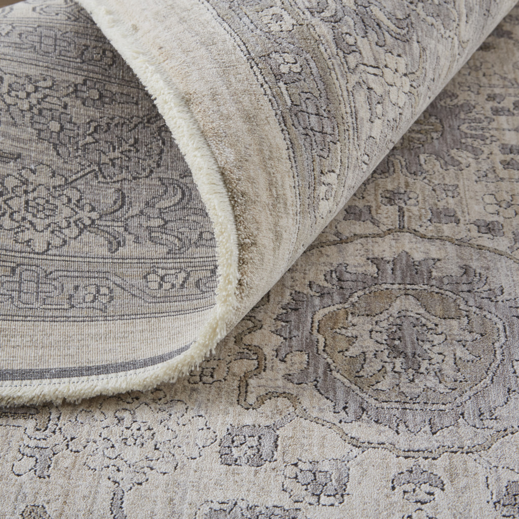 2" X 3" Gray and Ivory Oriental Power Loom Worn Faded Area Rug With Fringe