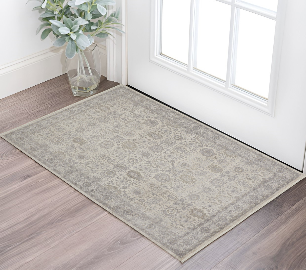 2" X 3" Gray and Ivory Oriental Power Loom Worn Faded Area Rug With Fringe