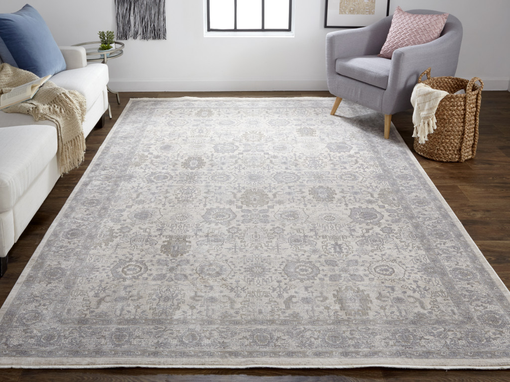 2" X 3" Gray and Ivory Oriental Power Loom Worn Faded Area Rug With Fringe
