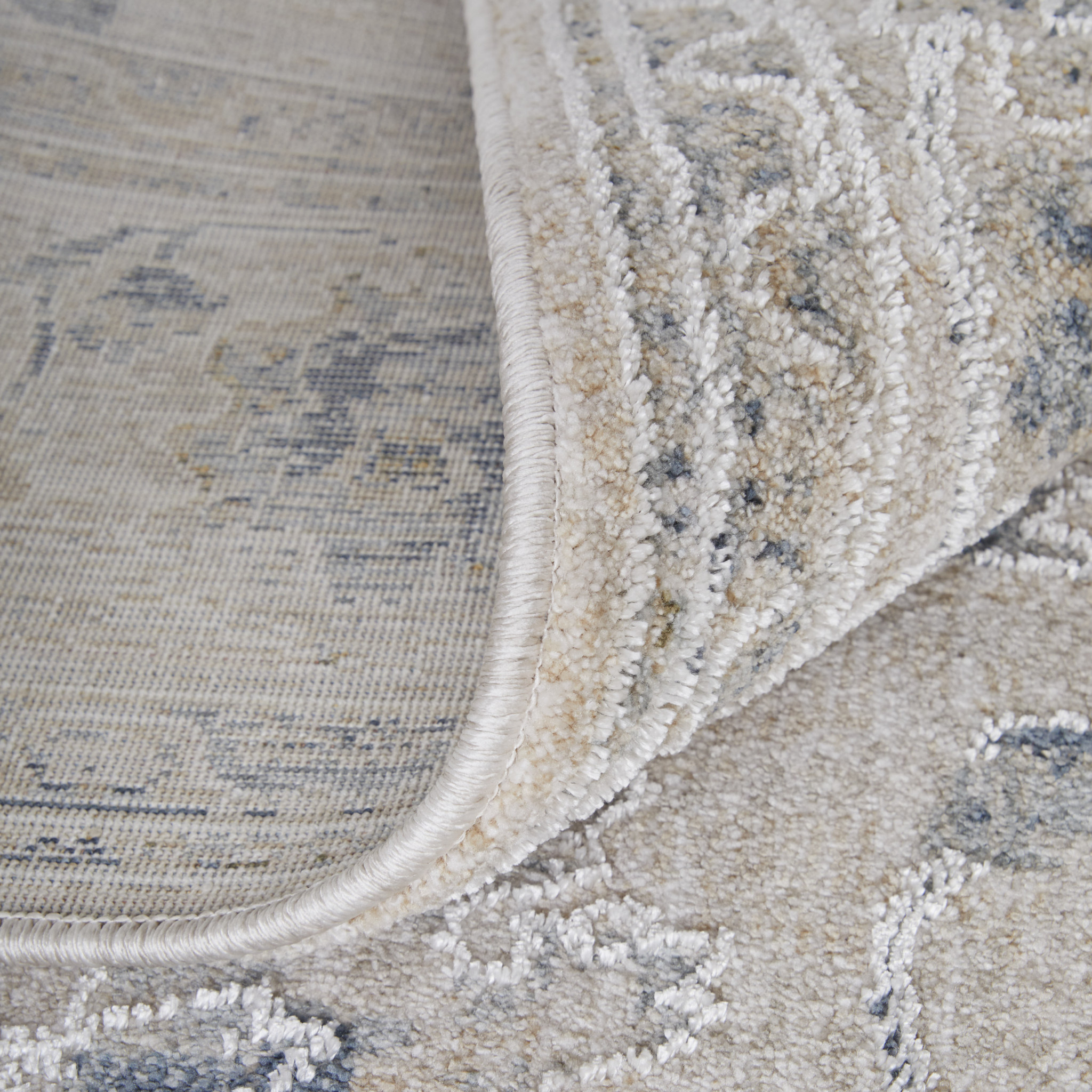 9" X 13" Ivory Taupe and Blue Floral Power Loom Worn Faded Area Rug With Fringe