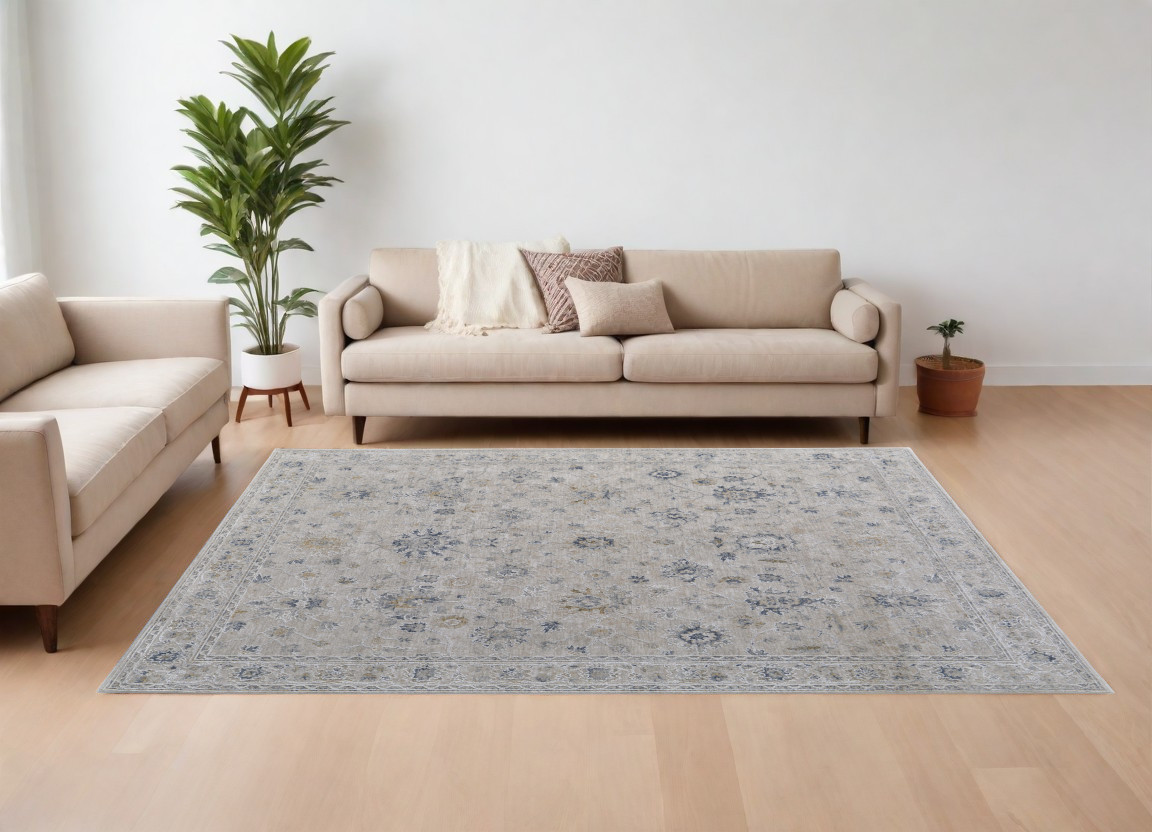 9" X 13" Ivory Taupe and Blue Floral Power Loom Worn Faded Area Rug With Fringe