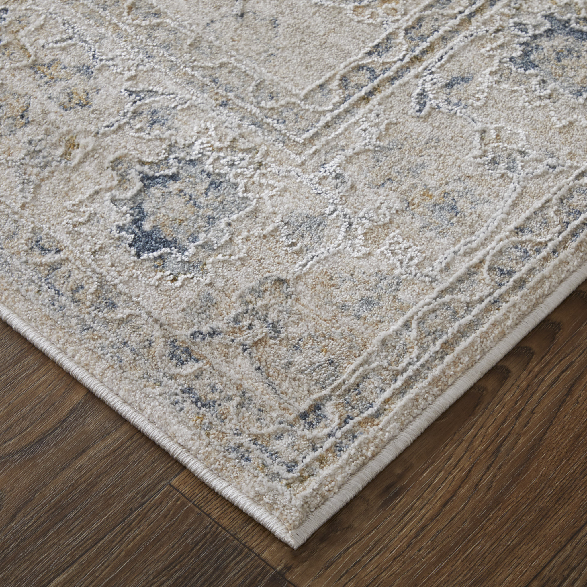 9" X 13" Ivory Taupe and Blue Floral Power Loom Worn Faded Area Rug With Fringe