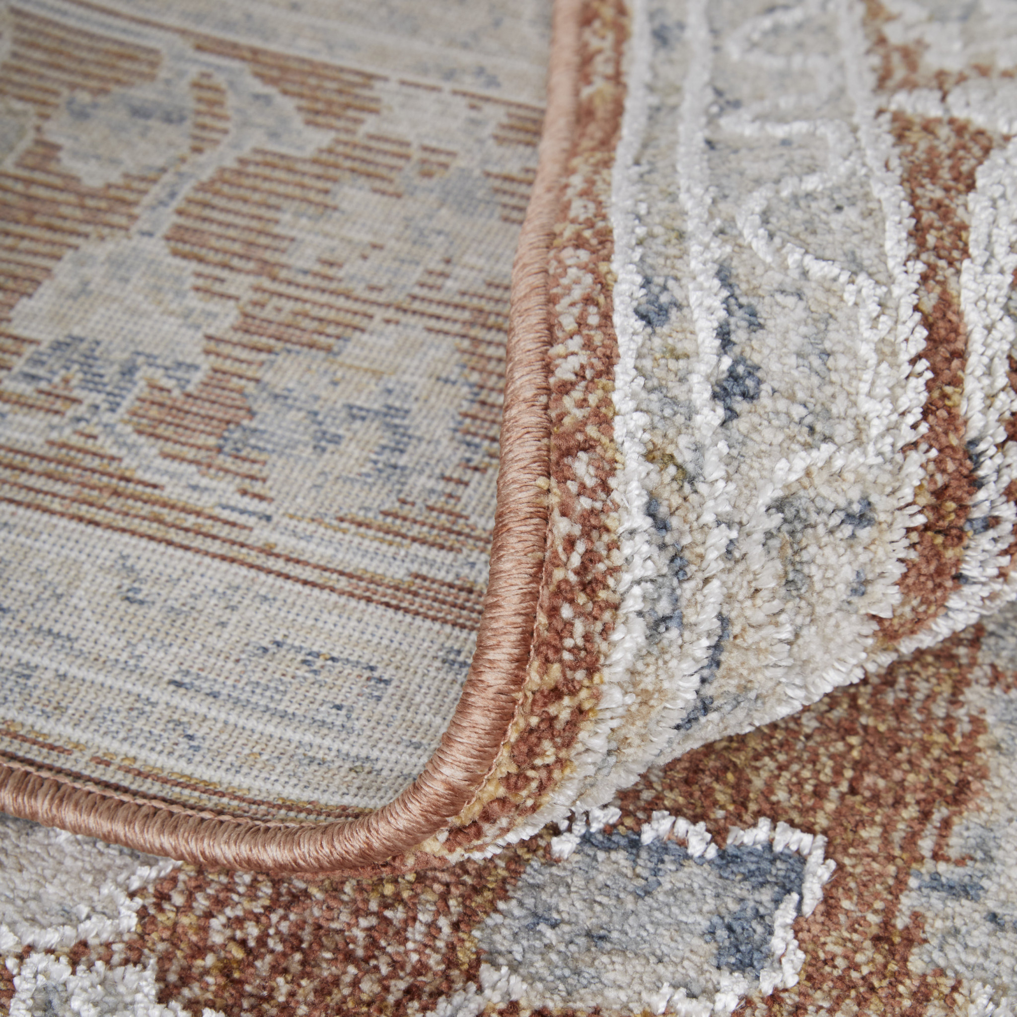 2" X 3" Red Blue and Ivory Floral Power Loom Worn Faded Area Rug With Fringe