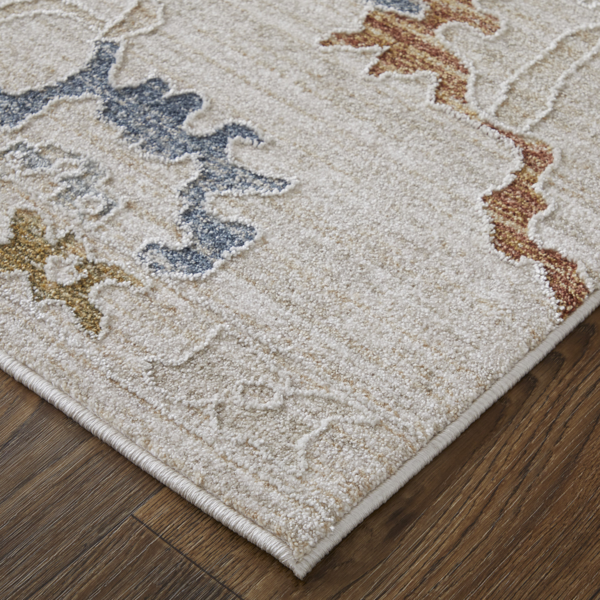 2" X 3" Ivory Blue and Gold Floral Power Loom Worn Faded Area Rug With Fringe