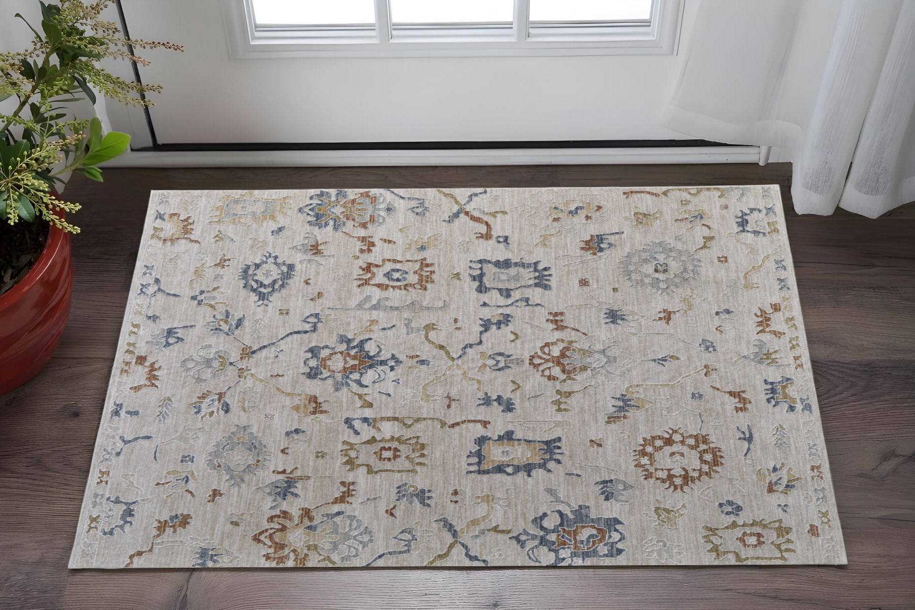 2" X 3" Ivory Blue and Gold Floral Power Loom Worn Faded Area Rug With Fringe