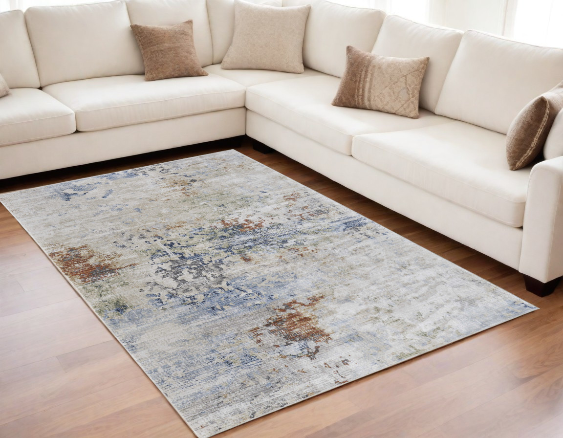 5" X 8" Red Blue and Ivory Abstract Power Loom Area Rug