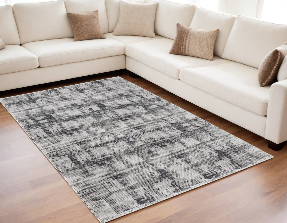 5" X 8" Gray and Ivory Abstract Power Loom Area Rug