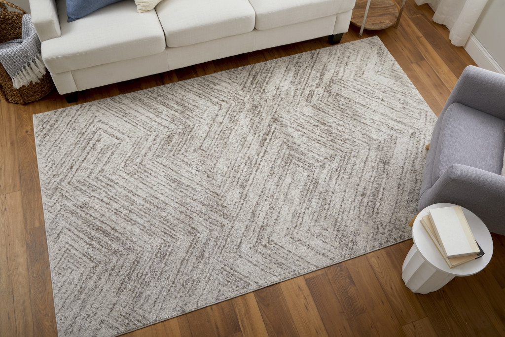 7" X 10" Ivory and Brown Geometric Power Loom Area Rug