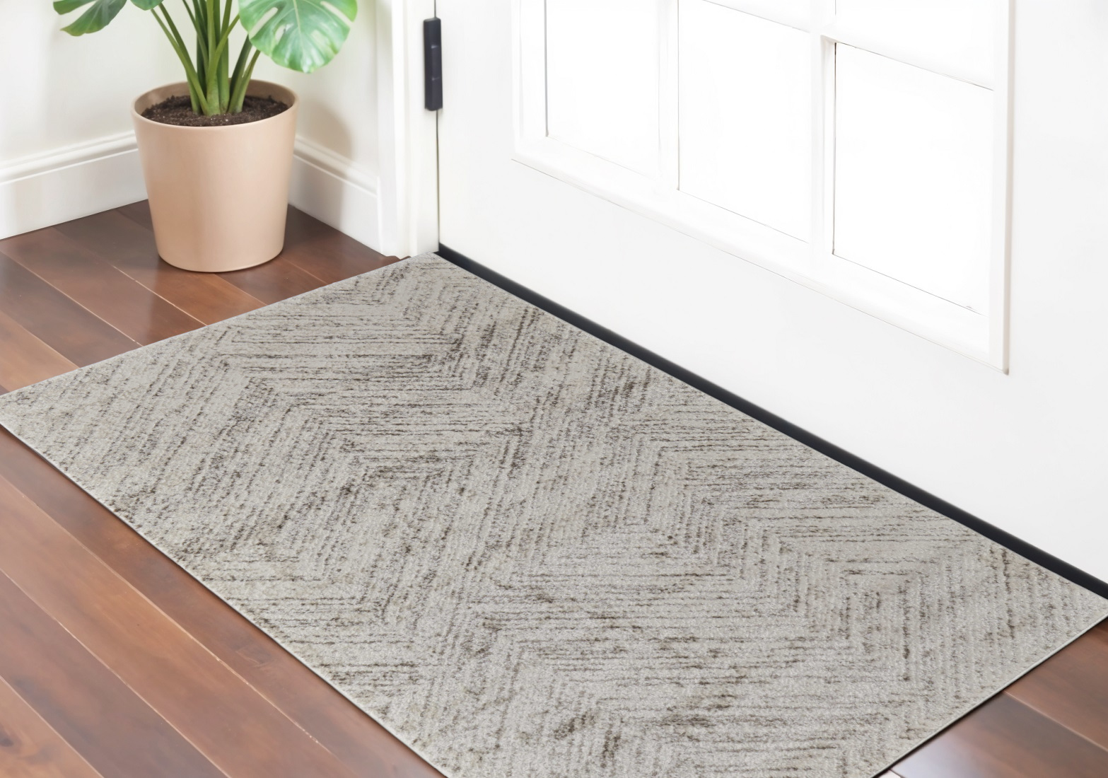 2" X 3" Ivory and Brown Geometric Power Loom Area Rug