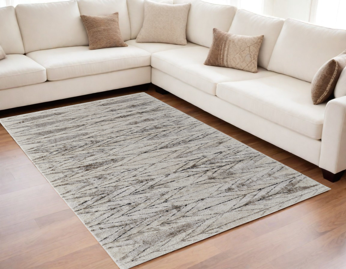 5" X 8" Ivory and Brown Geometric Power Loom Area Rug