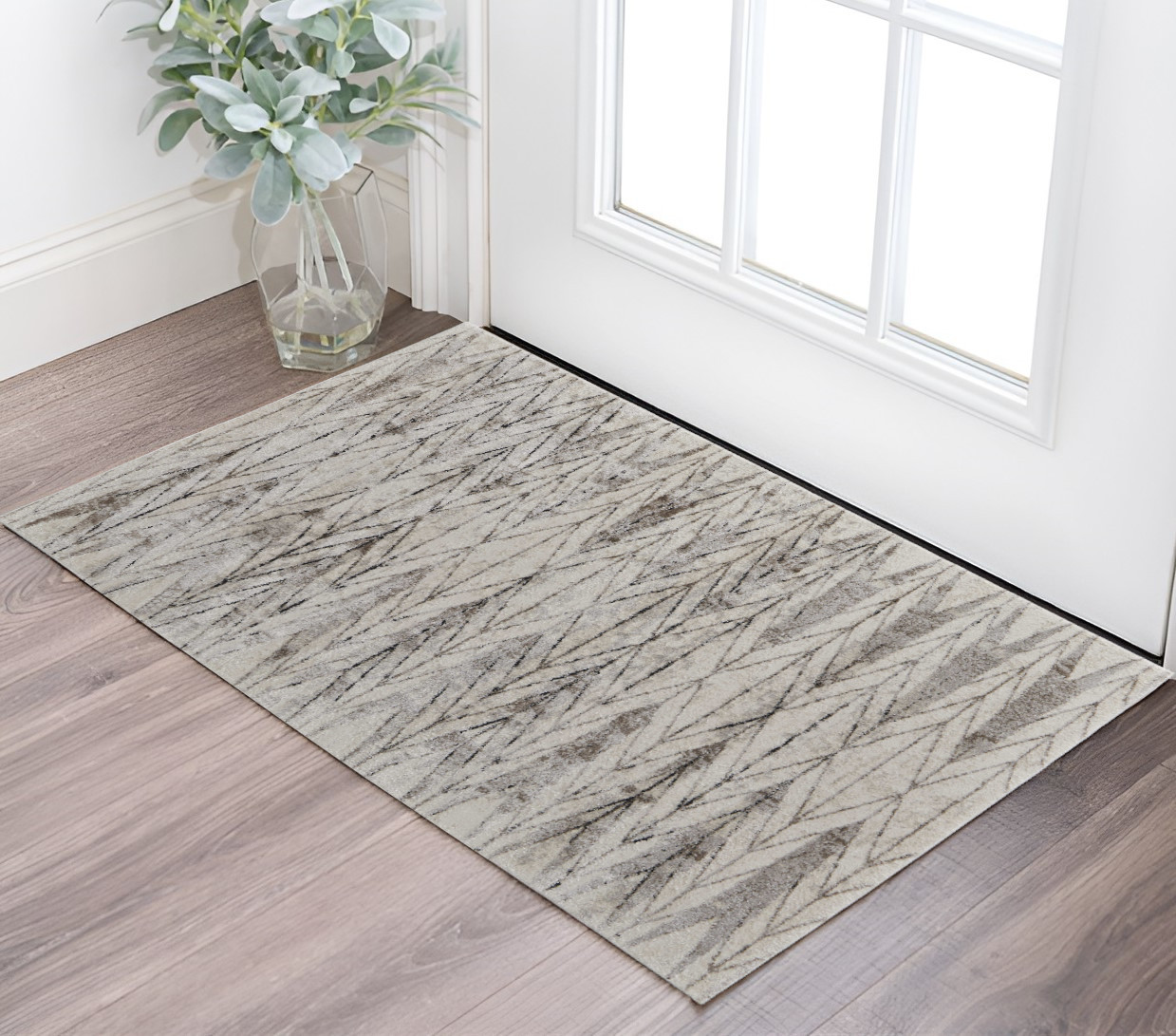 2" X 3" Ivory and Brown Geometric Power Loom Area Rug