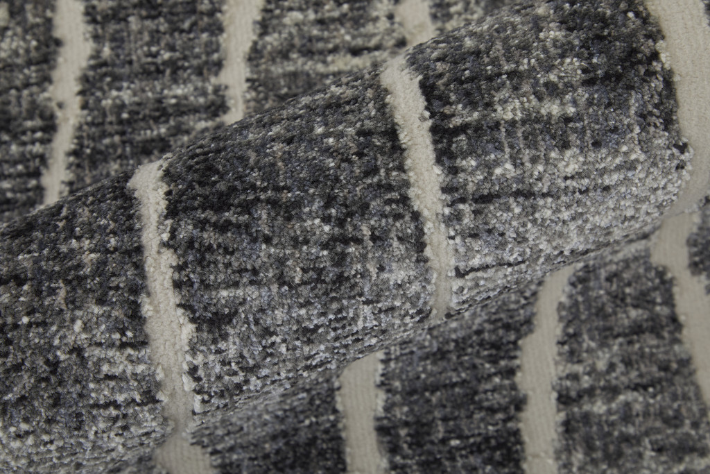 2" X 3" Black Gray and Ivory Abstract Power Loom Area Rug
