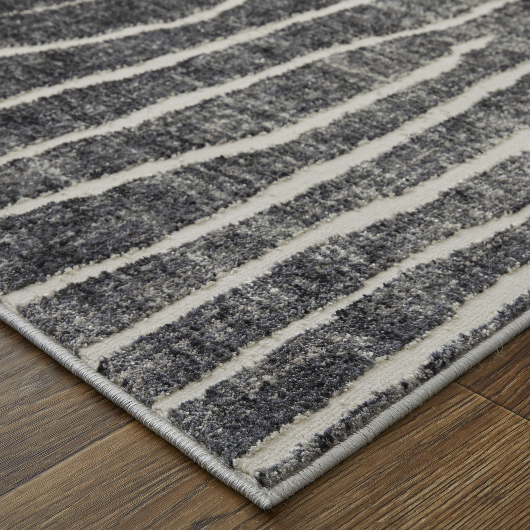 2" X 3" Black Gray and Ivory Abstract Power Loom Area Rug