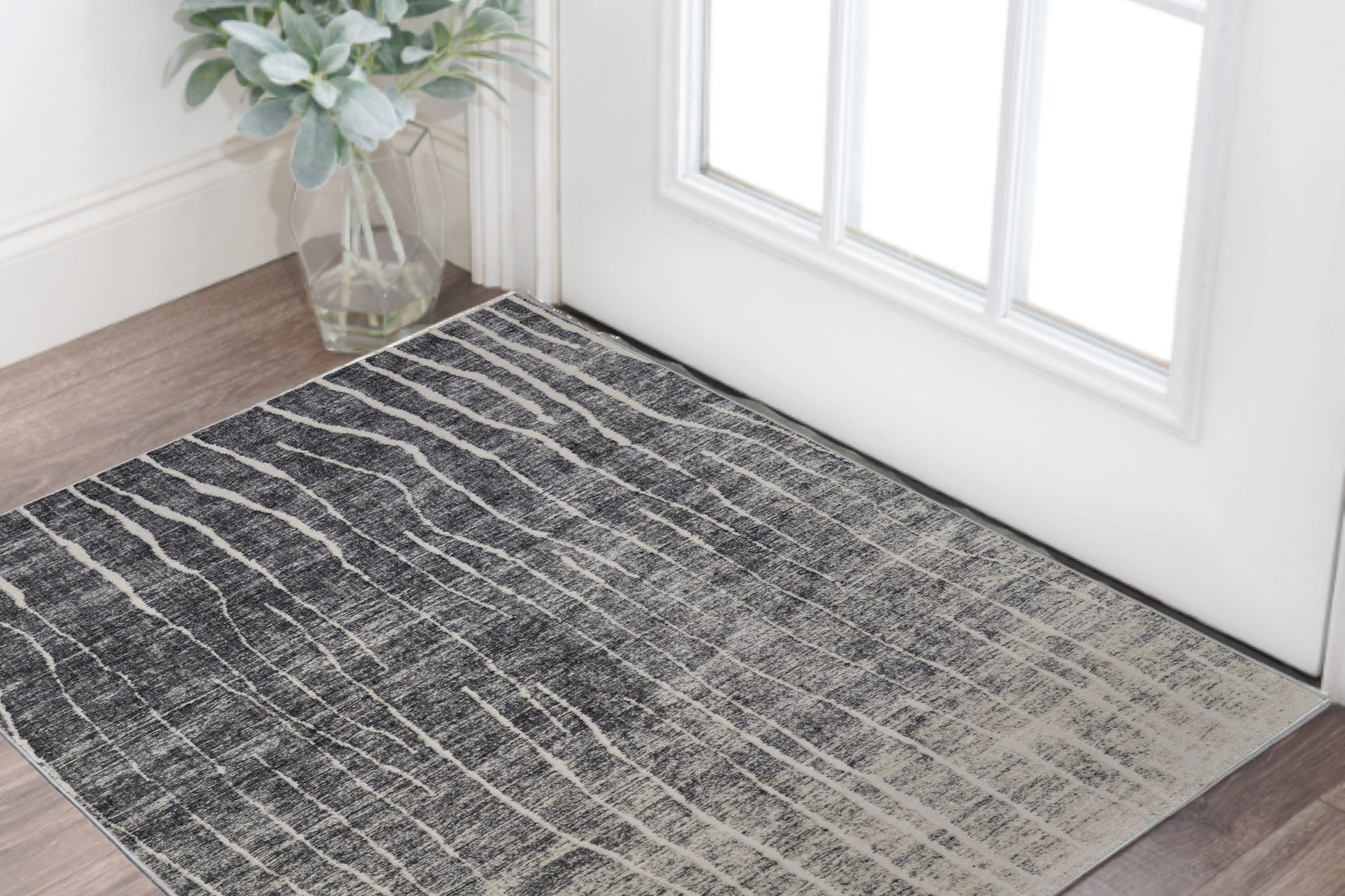 2" X 3" Black Gray and Ivory Abstract Power Loom Area Rug