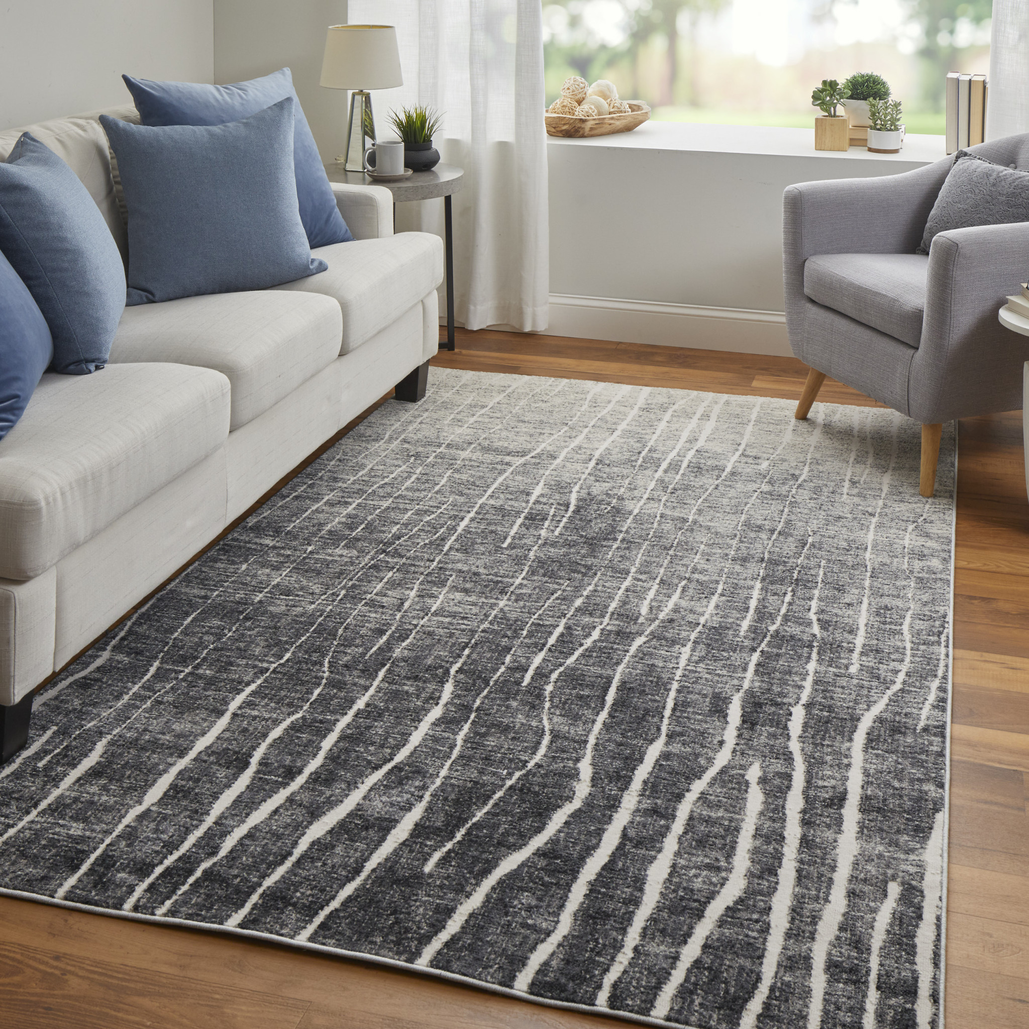 2" X 3" Black Gray and Ivory Abstract Power Loom Area Rug