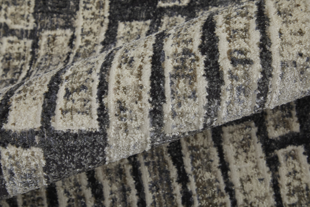 2" X 3" Gray Black and Ivory Geometric Power Loom Worn Faded Area Rug