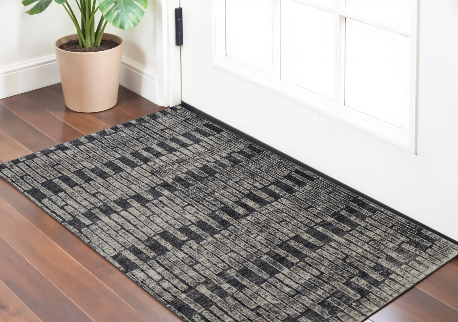 2" X 3" Gray Black and Ivory Geometric Power Loom Worn Faded Area Rug
