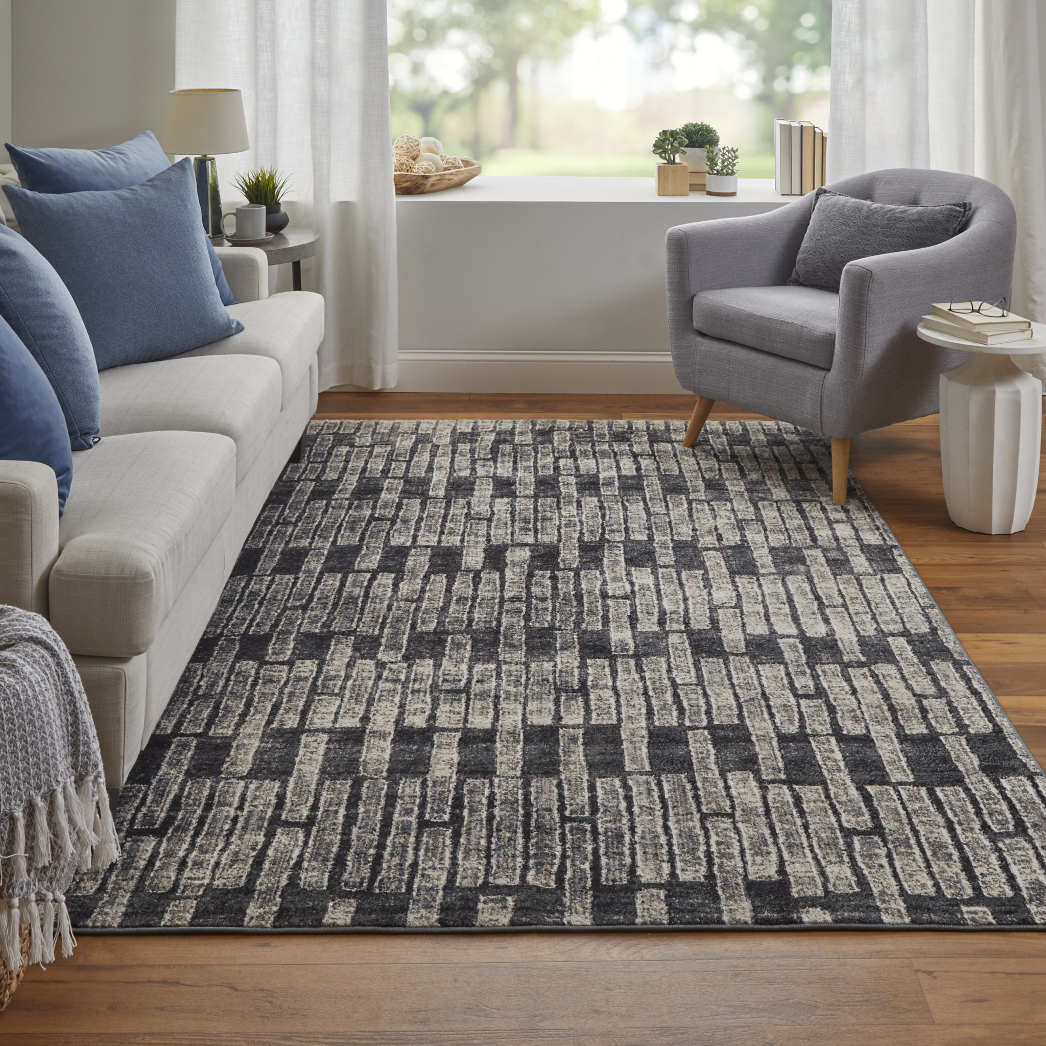 2" X 3" Gray Black and Ivory Geometric Power Loom Worn Faded Area Rug