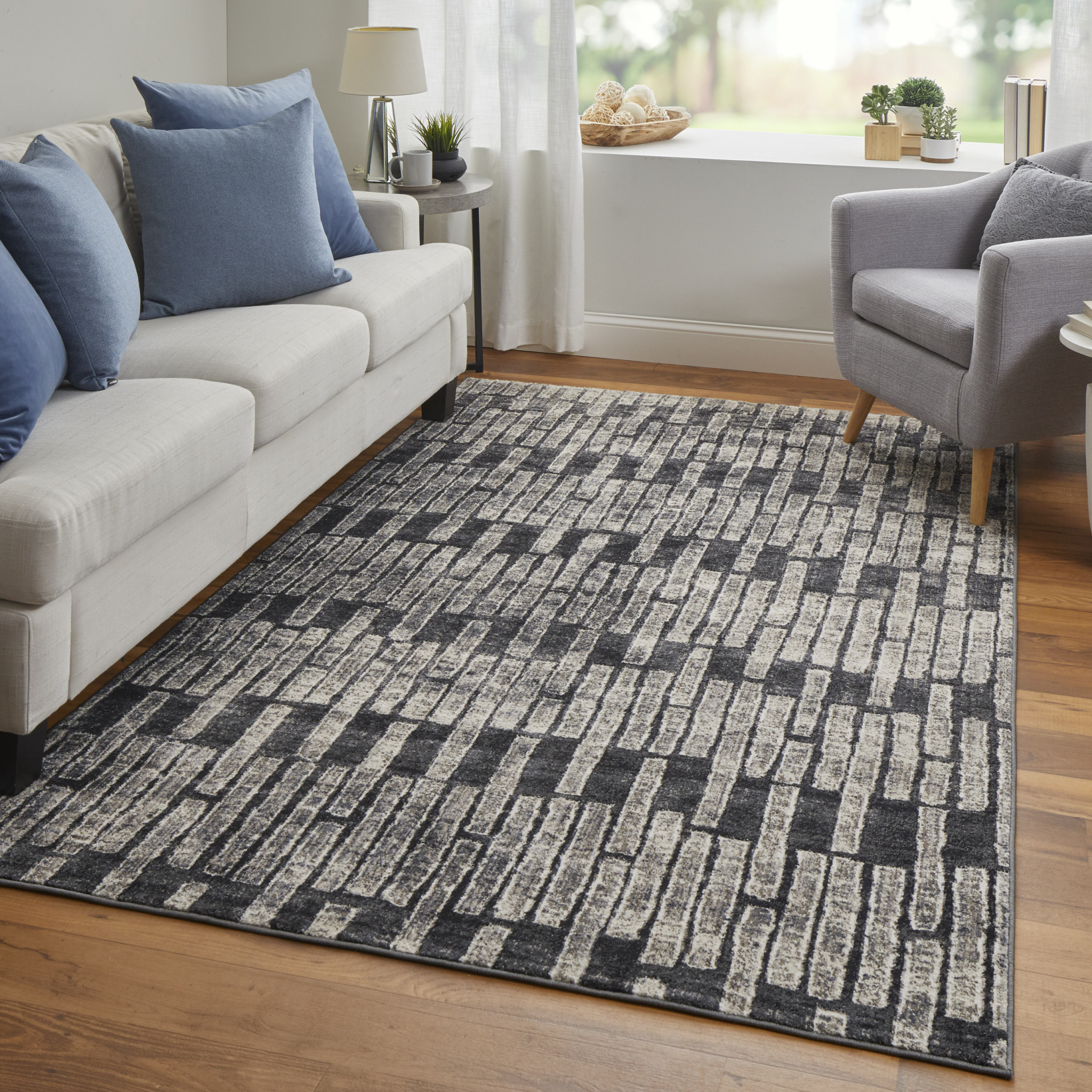 2" X 3" Gray Black and Ivory Geometric Power Loom Worn Faded Area Rug
